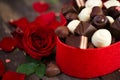 Chocolates in heart shaped box and red roses background- Mother Royalty Free Stock Photo